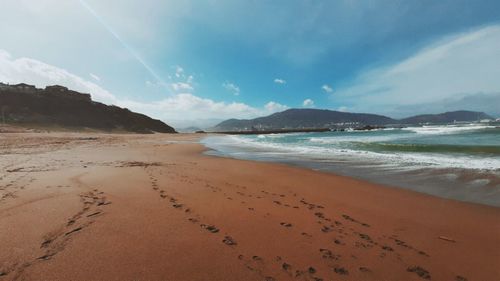 Scenic view of beach against sky