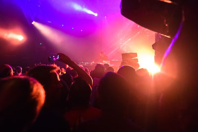 Rear view of people enjoying music concert