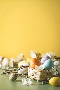 Close-up of christmas decorations on yellow background