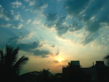 Low angle view of cloudy sky at sunset