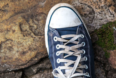 Close-up of slippers over the sea