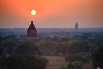 Silhouette of temple against sky during sunset