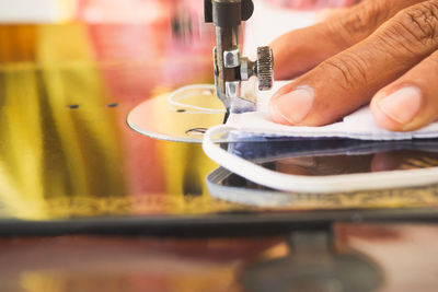 Close-up of hand holding machine