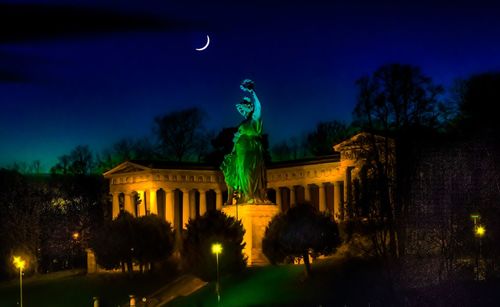 Low angle view of statue at night