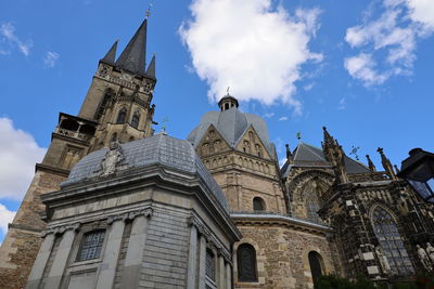 Low angle view of cathedral in aachen against sky