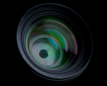 Close-up of camera on black background