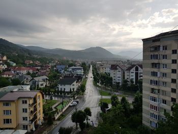 High angle view of buildings in city against sky