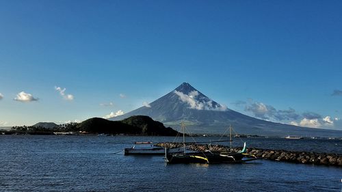 Scenic view of sea against clear blue sky