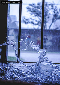 Close-up of frozen water against sky