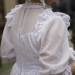 Close-up of woman holding white flower