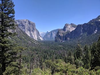 Scenic view of mountains against clear blue sky