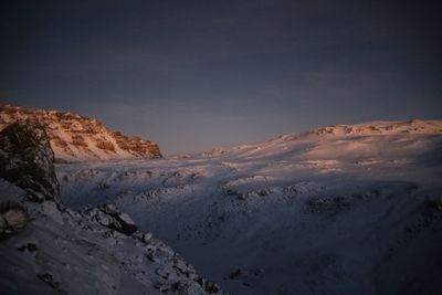 Scenic view of mountains against sky during winter