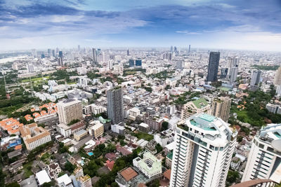 High angle view of modern buildings in city against sky