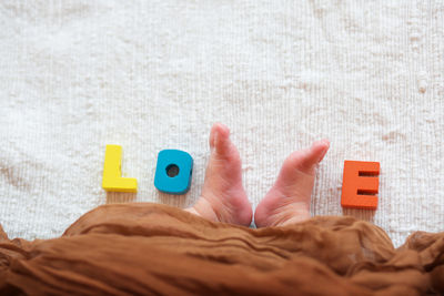 Low section of baby with toy blocks