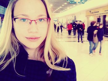 Young woman looking at railroad station