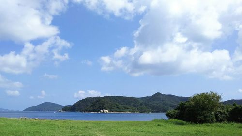 Scenic view of landscape against cloudy sky