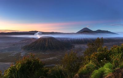 View of volcanic landscape against sky