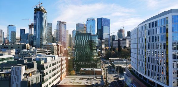 Modern buildings in city against sky