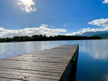 Pier over lake against sky