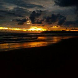 Scenic view of sea against cloudy sky