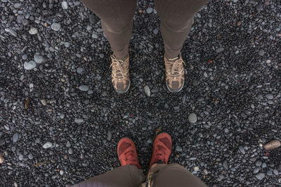 Low section of friends standing on ground