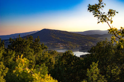 Scenic view of mountains against clear blue sky