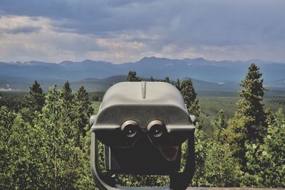 Quite the view through the binoculars over the mountains. raccoon trail, near golden, co.