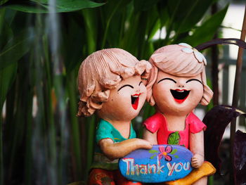 Close-up of figurine with thank you text