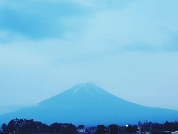 View of city against cloudy sky