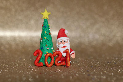 Close-up of figurine on christmas tree