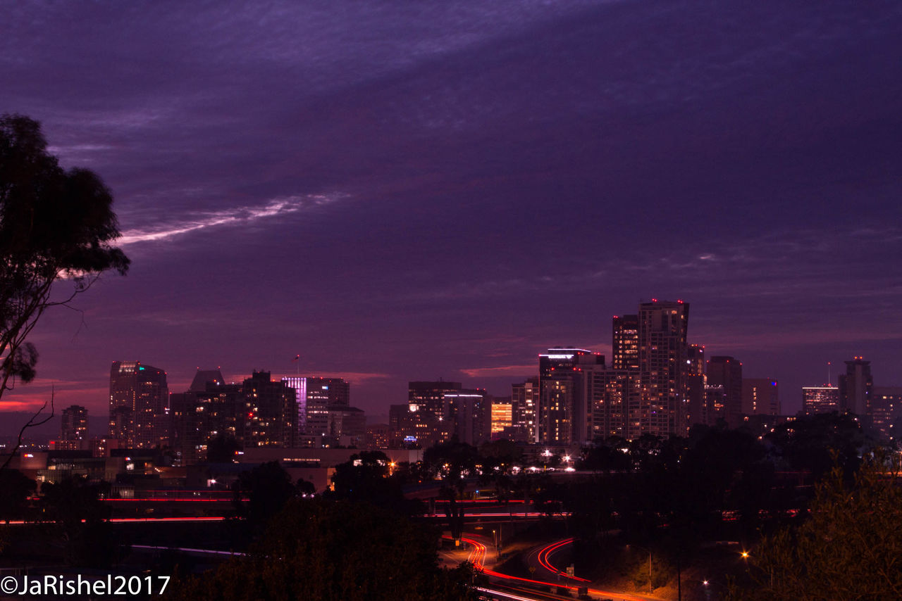 VIEW OF ILLUMINATED CITY AT NIGHT