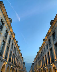 Low angle view of buildings against blue sky