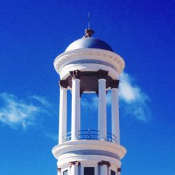 Low angle view of tower against blue sky