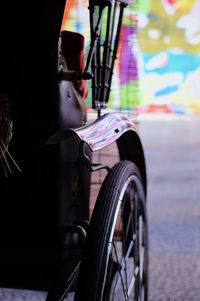 Close-up of motorcycle on street