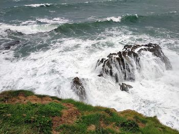 Waves splashing on rocks at shore