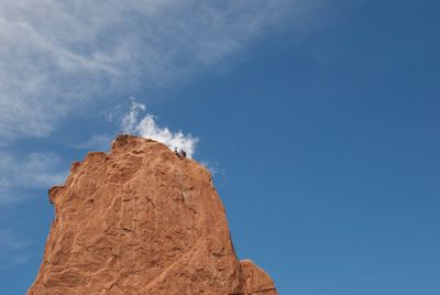 Low angle view of built structure against blue sky