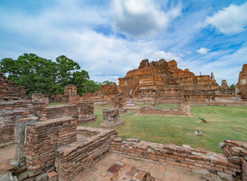 Old ruins of temple against cloudy sky