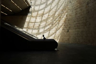 Full length of woman standing in front of building