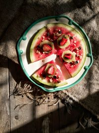 Directly above view of fresh fruits in plate on table