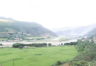 High angle view of houses on mountain against sky