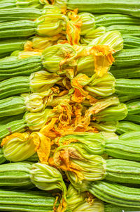 Full frame shot of zucchini with flowers at market