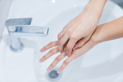 Midsection of woman in bathroom