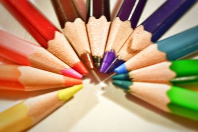 Close-up of multi colored pencils on table