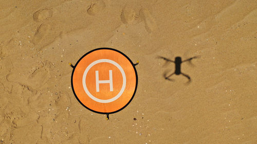High angle view of sign on beach