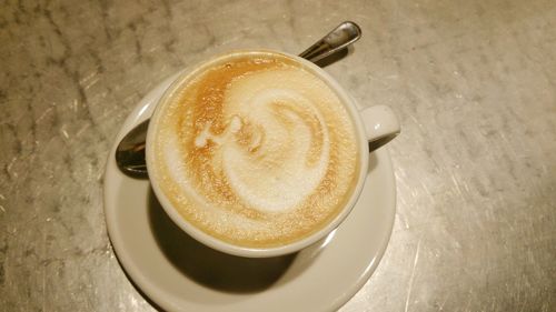 High angle view of cappuccino on table