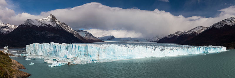 Panoramic view of glaciers against sky