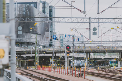 Train at railroad station against sky