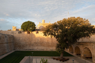 View of historic building against cloudy sky