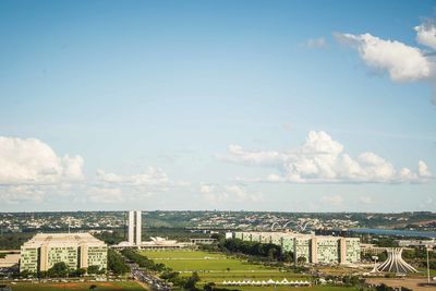 High angle view of buildings in city against sky