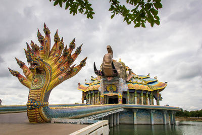 Statue of historic building against sky